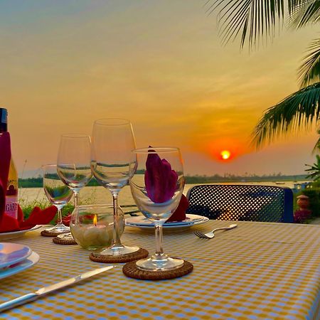 Bel Marina Hoi An Resort Екстериор снимка Sunset at the Riverine Restaurant